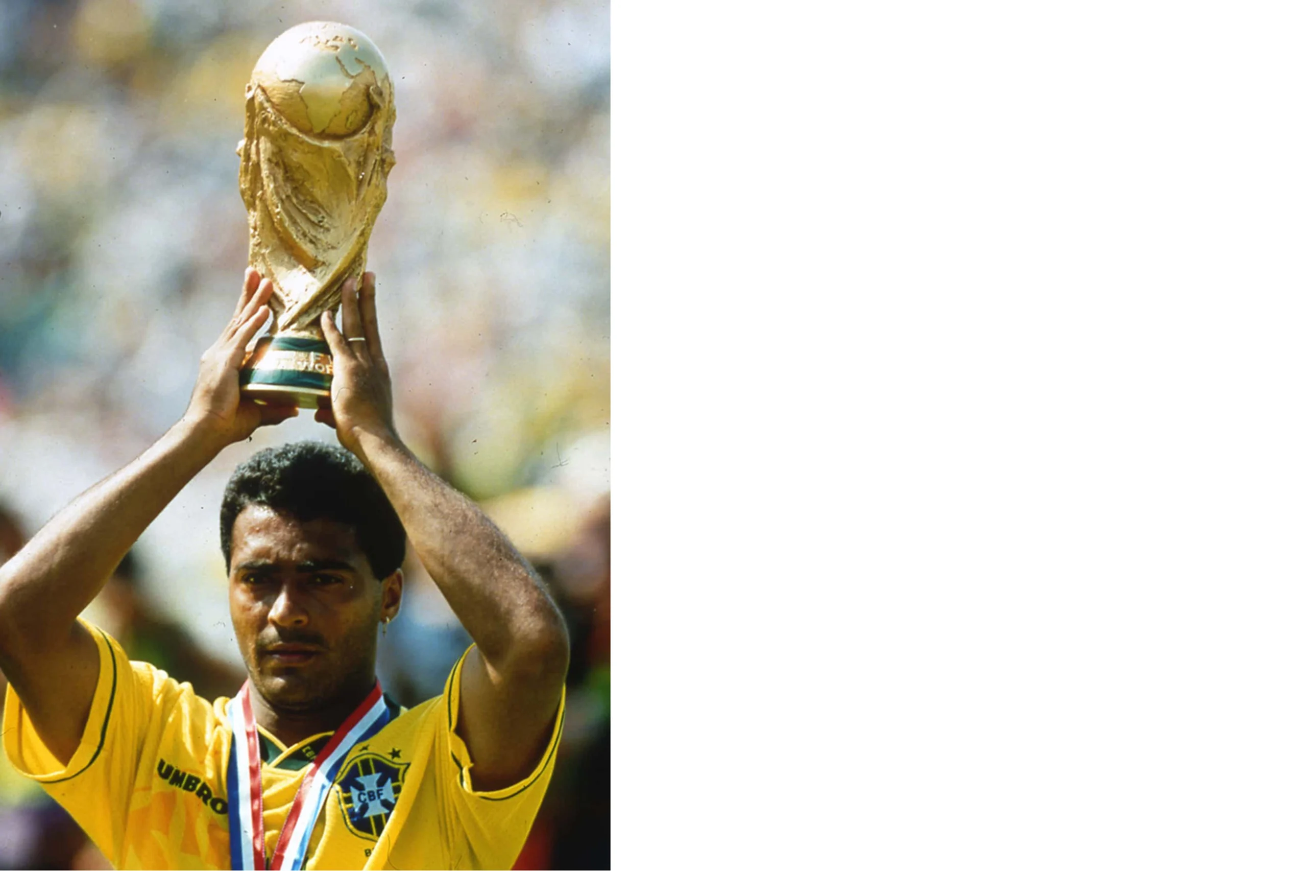 Brazil striker Romario raising the 1994 World Cup trophy at the Rose Bowl while wearing Nike Tiempo boots