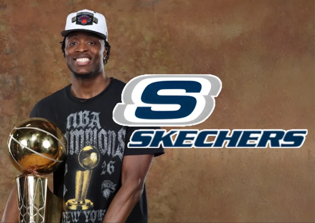 OG Anunoby holding the NBA championship trophy in Skechers