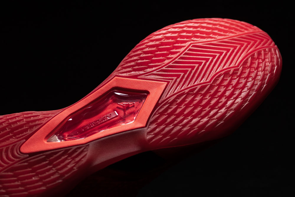 Air Jordan 41 outsole showing herringbone traction across the forefoot and the diamond TPU window at the midfoot