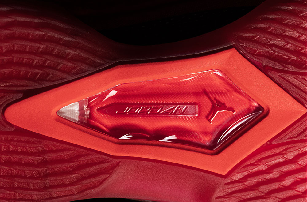Diamond-shaped clear TPU window in the Air Jordan 41 Ruby outsole with the Jumpman and AIR JORDAN visible underneath