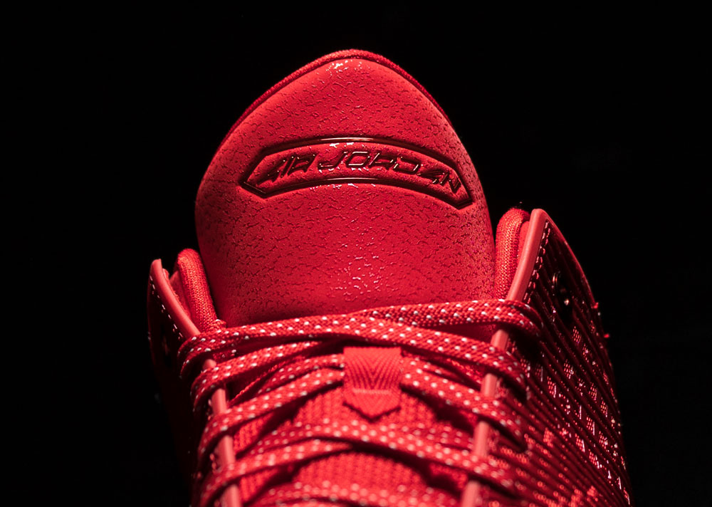 Debossed AIR JORDAN wordmark on the speckled red tongue of the Air Jordan 41 Ruby