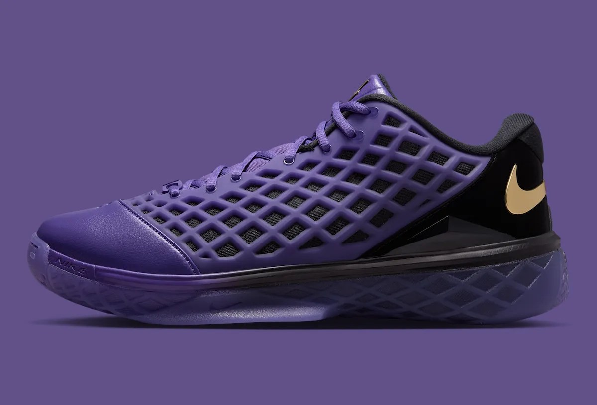 Metallic gold FC Barcelona crest and Kobe Sheath logo on the tongues of the purple Nike Kobe 3 Low Protro
