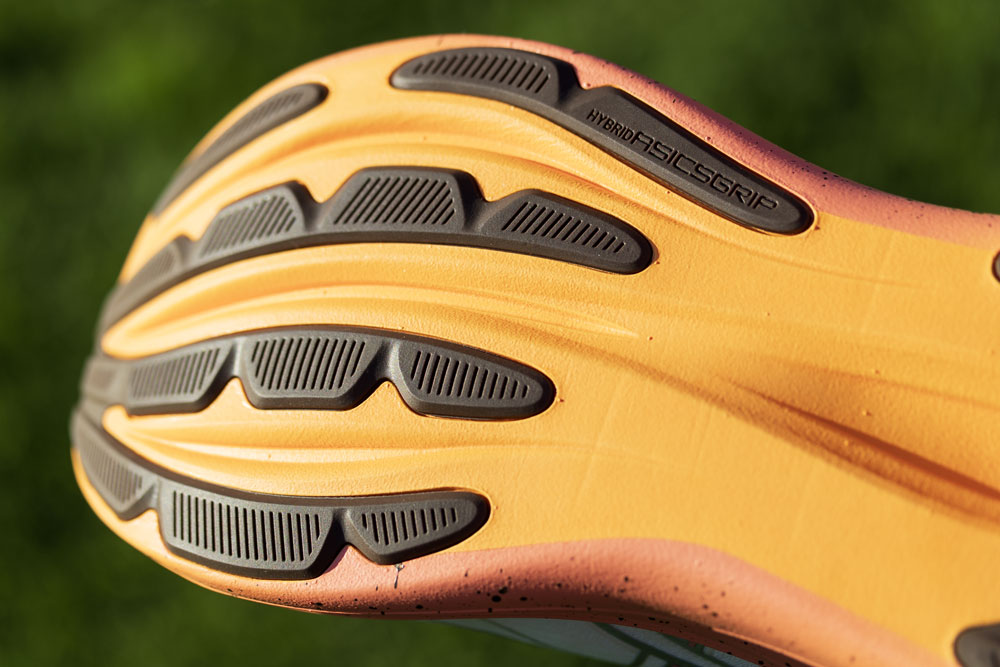 HYBRID ASICSGRIP rubber pods on the orange outsole of the ASICS x FP Movement GEL-Nimbus 28
