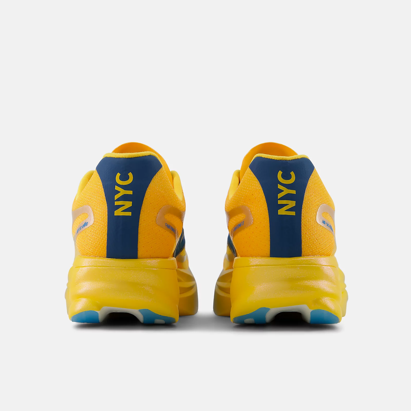 Heel view of the New Balance SuperComp Elite v6 TCS NYC Marathon with NYC in yellow block letters on the navy heel panel