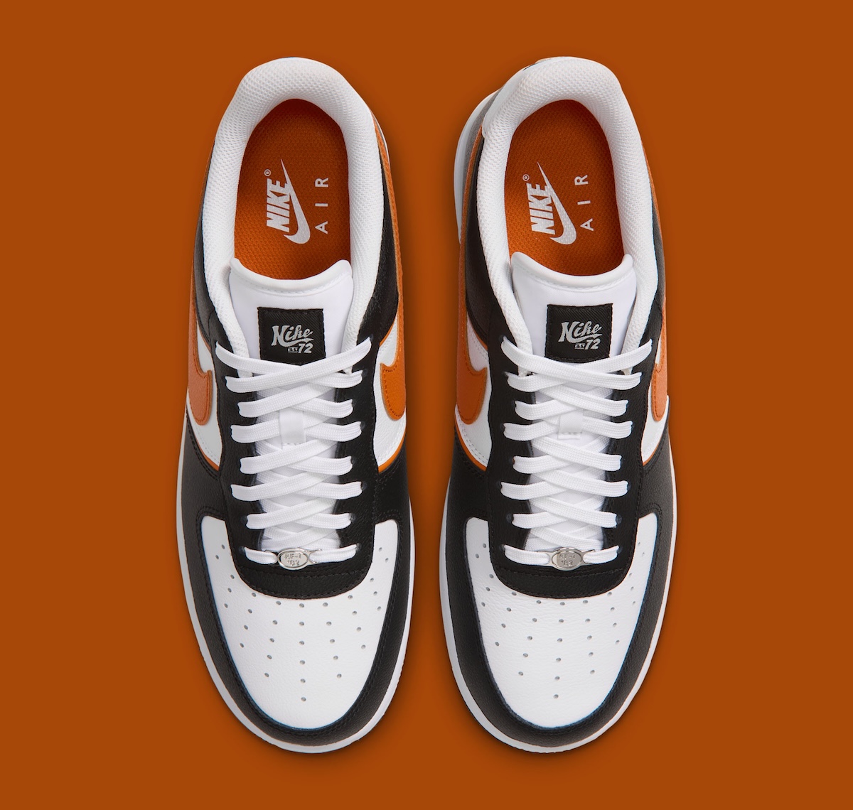 Top down view of the Nike Air Force 1 Low Campfire Orange showing white laces, silver dubraes and the diamond tongue label
