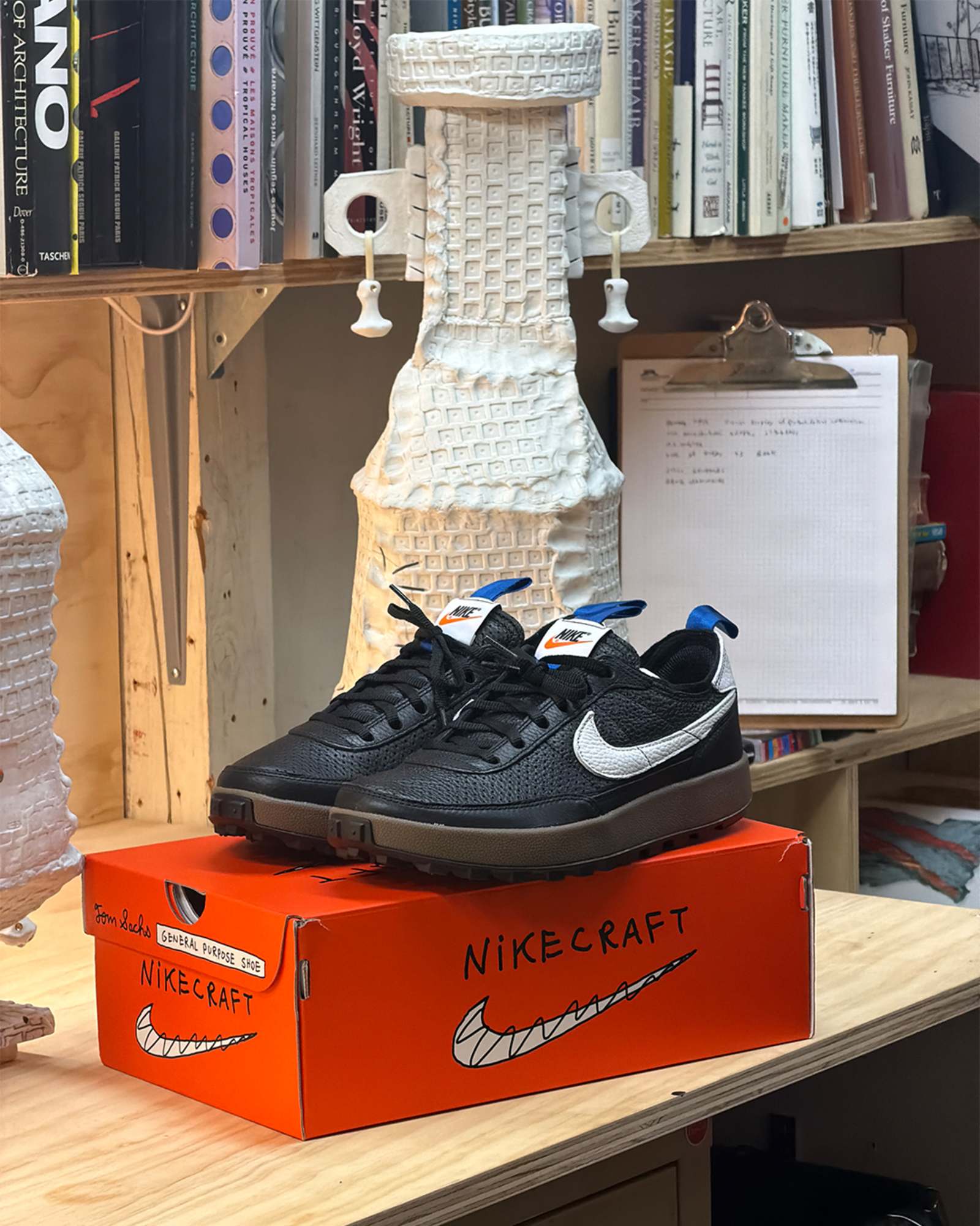 Nike General Purpose Shoe Demerits pair photographed on a NikeCraft box in a studio
