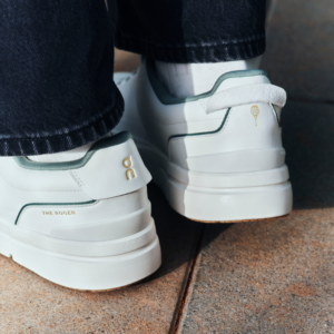 On THE ROGER Centre Court International Tennis Hall of Fame edition in Ivory and Fern with gold accents