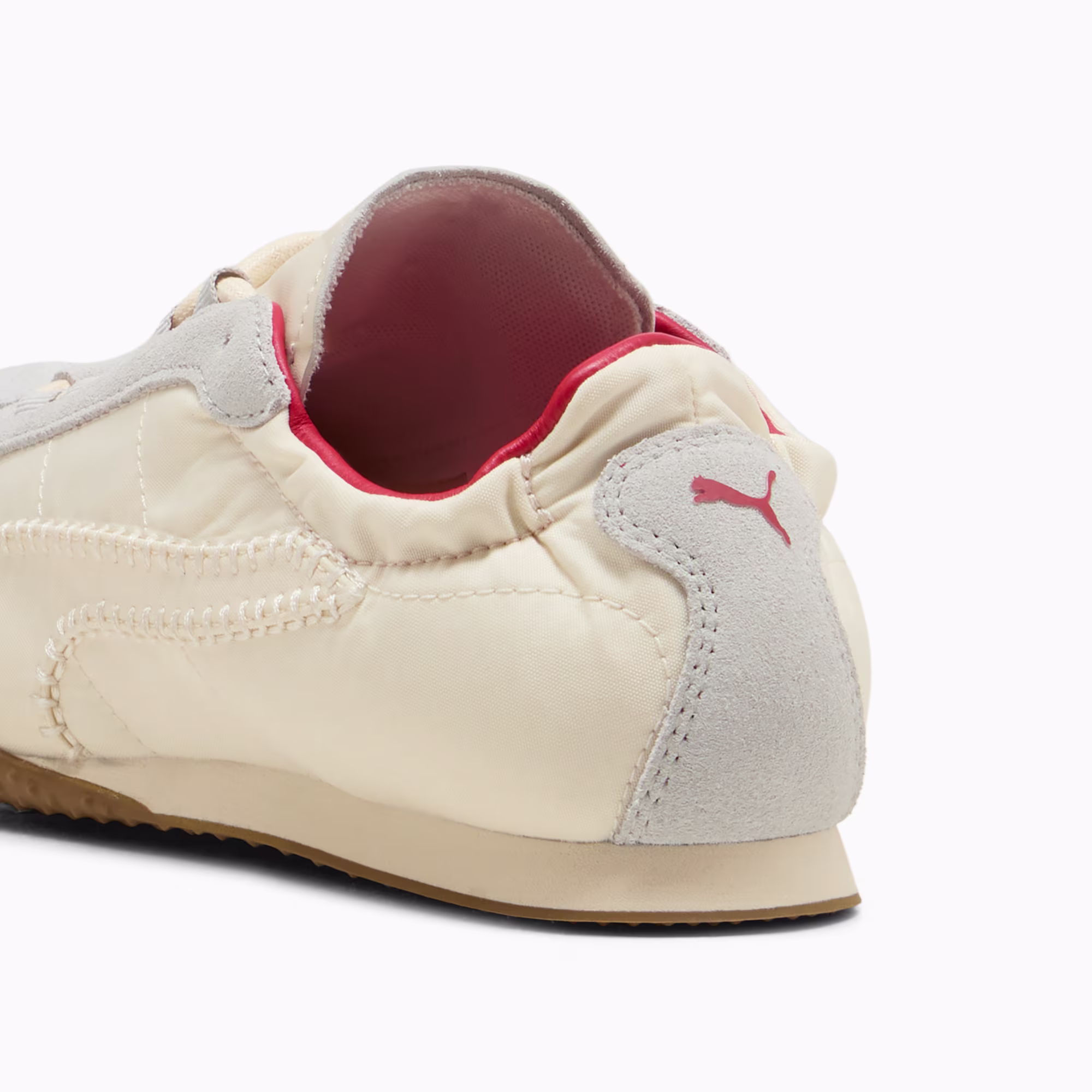 Heel of the PUMA x Madhappy H-Street in Alpine Snow and Cool Light Gray, showing the red collar lining and a red PUMA cat on the grey suede heel panel