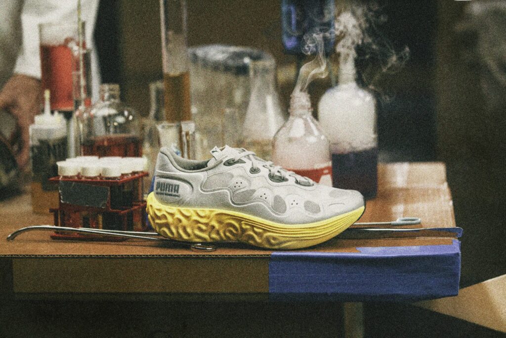 PUMA x Salehe Bembury Velum 2 NITRO in Cool Light Gray-PUMA Silver showing the sculpted yellow NITROFOAM midsole