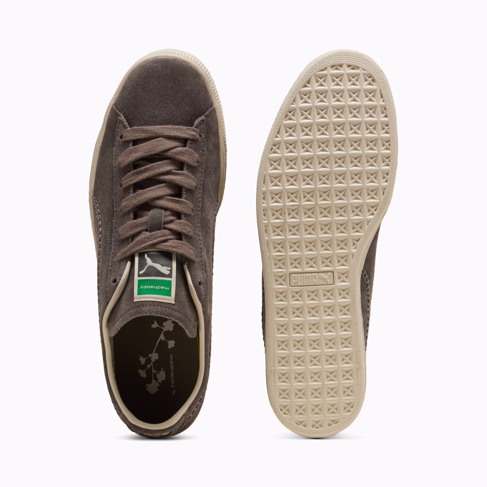 Top-down and outsole views of the PUMA x Madhappy Suede in Matte Bronze and Alpine Snow, showing the green PUMA tongue label and the cream diamond-pattern outsole
