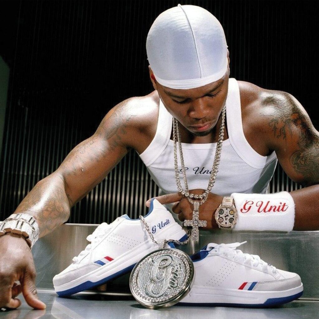 Reebok x G-Unit G6 campaign image showing the shoe worn with a white tank top and G-Unit wristband