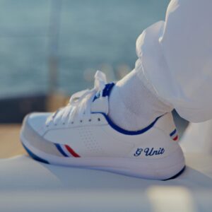 Reebok x G-Unit G6 in White, Blue and Red worn on foot, showing the G Unit script on the heel and the tricolour stripe